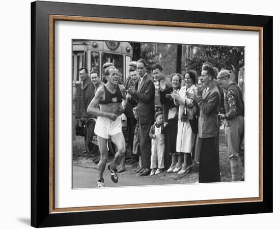 Emil Zatopek Leading in Marathon at 1952 Olympics-null-Framed Premium Photographic Print