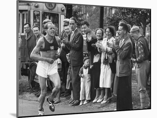 Emil Zatopek Leading in Marathon at 1952 Olympics-null-Mounted Premium Photographic Print