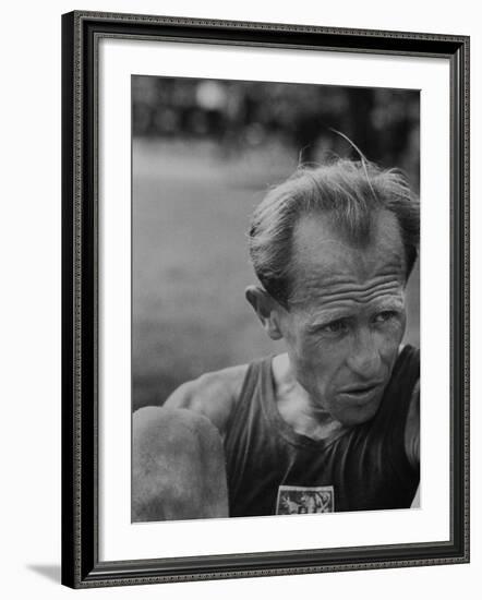 Emil Zatopek Sitting Tensely with Furrowed Brow after Winning Second of Three Olympic Races-Ralph Crane-Framed Premium Photographic Print