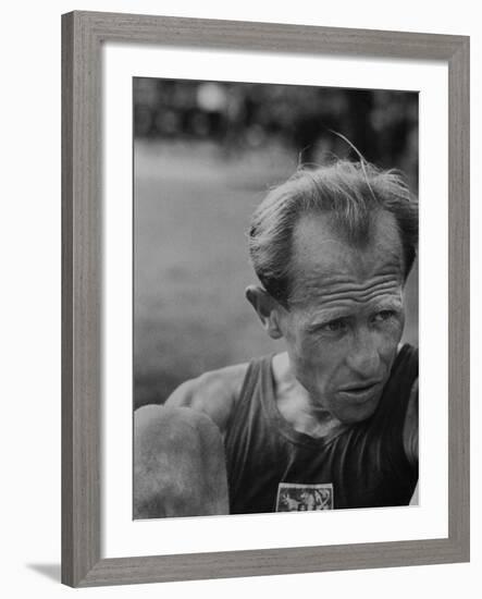 Emil Zatopek Sitting Tensely with Furrowed Brow after Winning Second of Three Olympic Races-Ralph Crane-Framed Premium Photographic Print