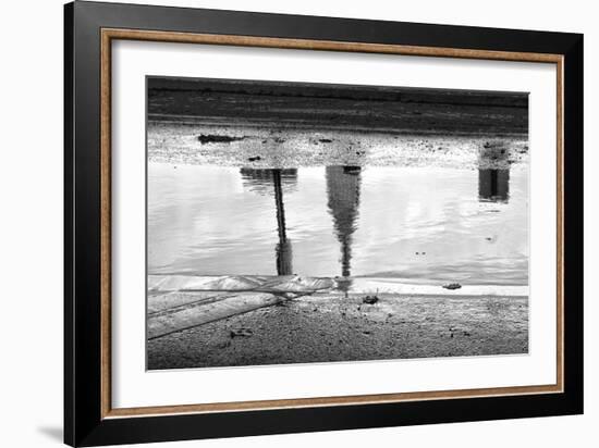 Empire State Building Reflection in Puddle-null-Framed Photo