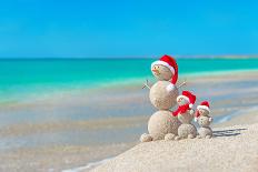 Snowmans Family at Sea Beach in Santa Hat. New Years and Christmas-EMprize-Laminated Photographic Print