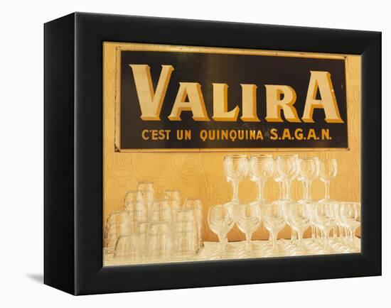 Empty Wine & Water Glasses in Front of Valira Publicity Sign-Peter Medilek-Framed Premier Image Canvas