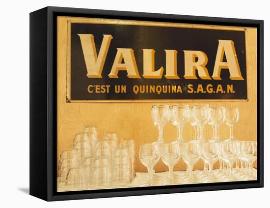 Empty Wine & Water Glasses in Front of Valira Publicity Sign-Peter Medilek-Framed Premier Image Canvas