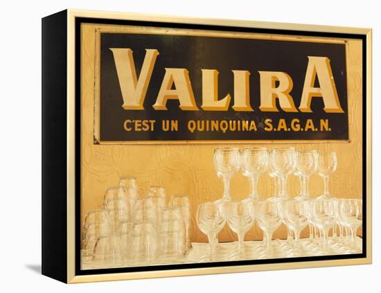Empty Wine & Water Glasses in Front of Valira Publicity Sign-Peter Medilek-Framed Premier Image Canvas