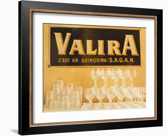 Empty Wine & Water Glasses in Front of Valira Publicity Sign-Peter Medilek-Framed Photographic Print