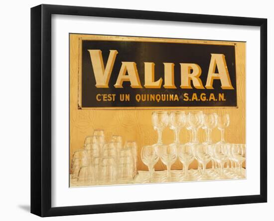 Empty Wine & Water Glasses in Front of Valira Publicity Sign-Peter Medilek-Framed Photographic Print