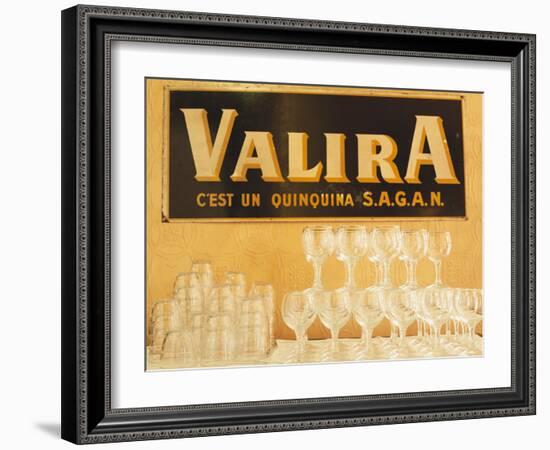 Empty Wine & Water Glasses in Front of Valira Publicity Sign-Peter Medilek-Framed Photographic Print