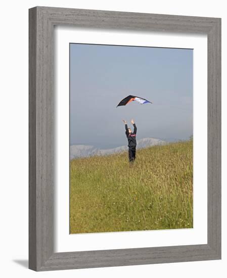 England, Isle of Wight; Boy Flying a Kite on the Downs Near Compton Bay in Southwest of the Island-Will Gray-Framed Photographic Print