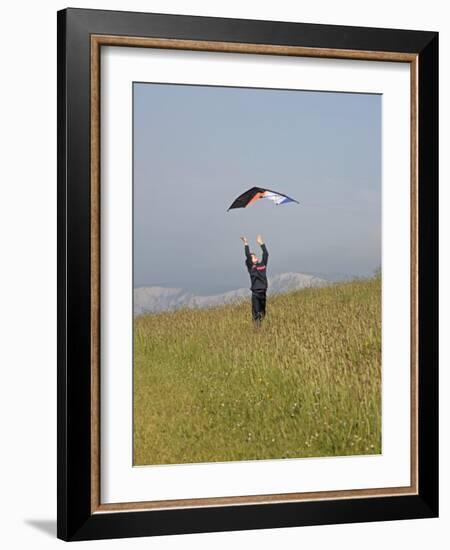 England, Isle of Wight; Boy Flying a Kite on the Downs Near Compton Bay in Southwest of the Island-Will Gray-Framed Photographic Print