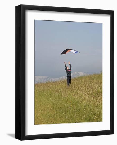 England, Isle of Wight; Boy Flying a Kite on the Downs Near Compton Bay in Southwest of the Island-Will Gray-Framed Photographic Print