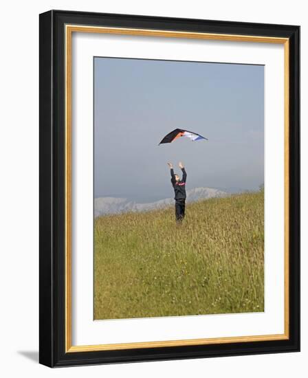 England, Isle of Wight; Boy Flying a Kite on the Downs Near Compton Bay in Southwest of the Island-Will Gray-Framed Photographic Print