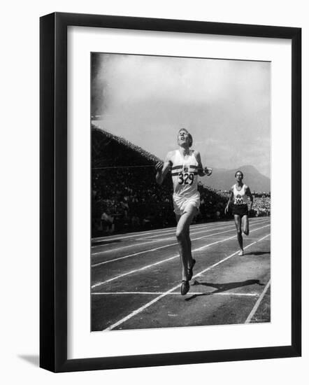 England's Dr. Roger Bannister Beating Australia's Mile Record Holder John Landy-Ralph Morse-Framed Premium Photographic Print