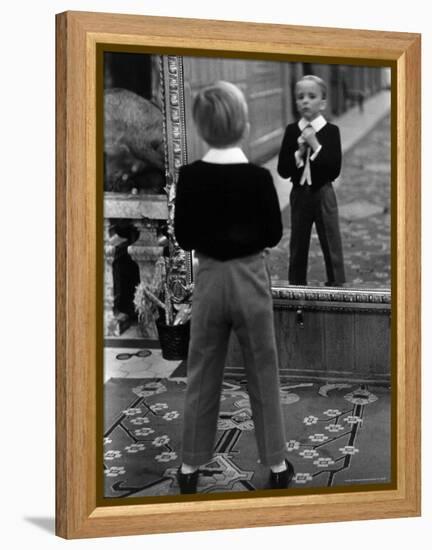 English Boy Using Reflection in Mirror in Foyer of Grand Hotel to Fix His Tie-Alfred Eisenstaedt-Framed Premier Image Canvas