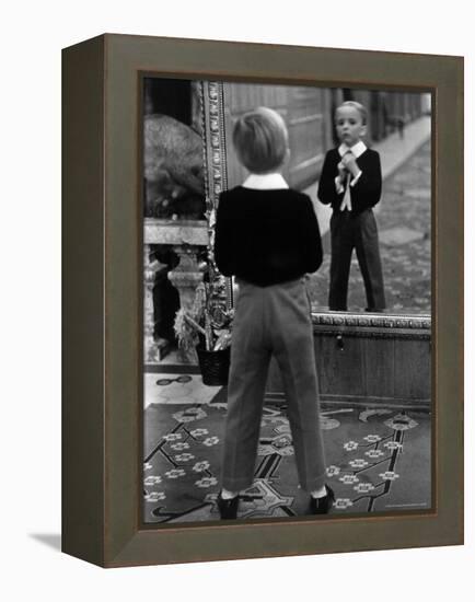 English Boy Using Reflection in Mirror in Foyer of Grand Hotel to Fix His Tie-Alfred Eisenstaedt-Framed Premier Image Canvas