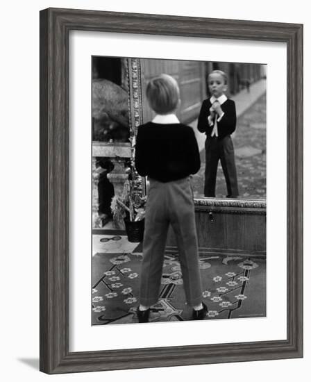 English Boy Using Reflection in Mirror in Foyer of Grand Hotel to Fix His Tie-Alfred Eisenstaedt-Framed Photographic Print