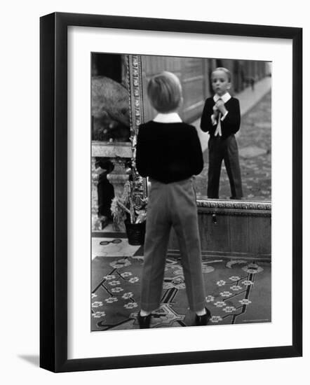 English Boy Using Reflection in Mirror in Foyer of Grand Hotel to Fix His Tie-Alfred Eisenstaedt-Framed Photographic Print