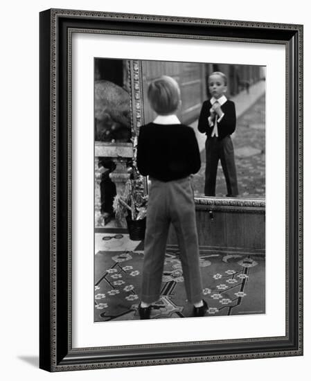 English Boy Using Reflection in Mirror in Foyer of Grand Hotel to Fix His Tie-Alfred Eisenstaedt-Framed Photographic Print
