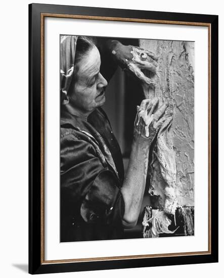 English Sculptor, Barbara Hepworth, at Work in Her Studio-Paul Schutzer-Framed Premium Photographic Print