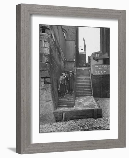 Englishmen Chatting as They Stand on Wapping Old Stairs Which Is a Great Thames Landmark-Carl Mydans-Framed Photographic Print