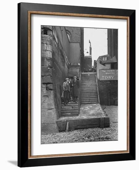 Englishmen Chatting as They Stand on Wapping Old Stairs Which Is a Great Thames Landmark-Carl Mydans-Framed Photographic Print