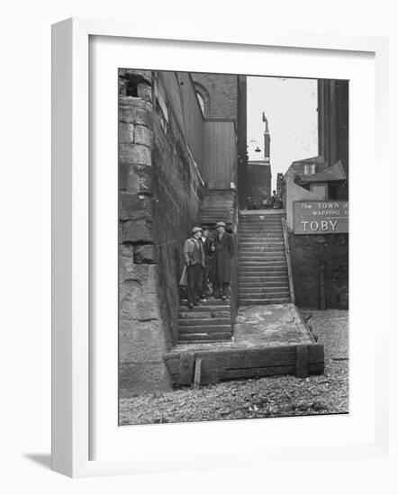 Englishmen Chatting as They Stand on Wapping Old Stairs Which Is a Great Thames Landmark-Carl Mydans-Framed Photographic Print