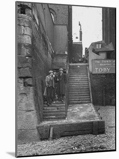 Englishmen Chatting as They Stand on Wapping Old Stairs Which Is a Great Thames Landmark-Carl Mydans-Mounted Photographic Print