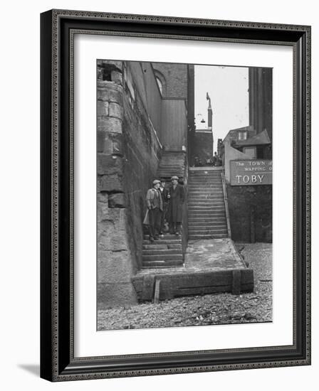 Englishmen Chatting as They Stand on Wapping Old Stairs Which Is a Great Thames Landmark-Carl Mydans-Framed Photographic Print