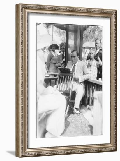 Enrico Caruso Leans Back on Chair Holding a Board with Music-null-Framed Art Print