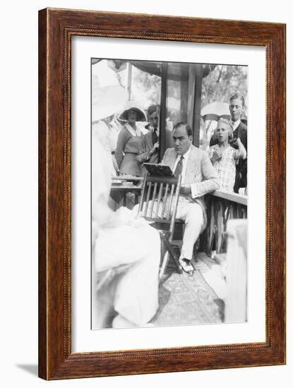 Enrico Caruso Leans Back on Chair Holding a Board with Music-null-Framed Art Print