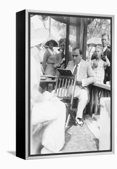 Enrico Caruso Leans Back on Chair Holding a Board with Music-null-Framed Stretched Canvas