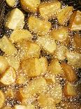 Potatoes Being Fried in Hot Oil-Enrique Chavarria-Mounted Photographic Print