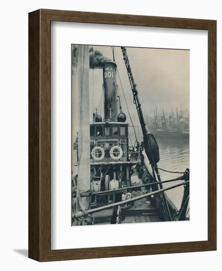 'Entering Grimsby Docks at the end of a North Sea voyage is the fishing vessel Saurian', 1937-Unknown-Framed Photographic Print