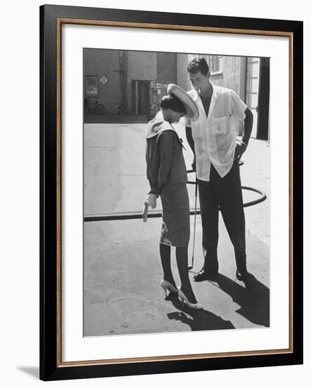 Entertainer Dean Martin Talking with Actress Pier Angeli on the Lot of a Studio-Allan Grant-Framed Premium Photographic Print