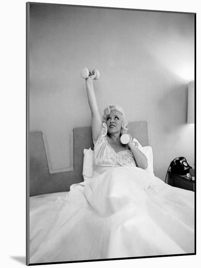 Entertainer Mae West Lifitng Barbells in Bed-Loomis Dean-Mounted Photographic Print