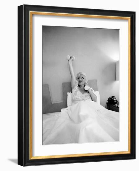 Entertainer Mae West Lifitng Barbells in Bed-Loomis Dean-Framed Photographic Print