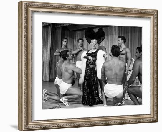 Entertainer Mae West Making Her Nightclub Debut with Loin-Clothed Dancers at Hotel Sahara-Loomis Dean-Framed Photographic Print