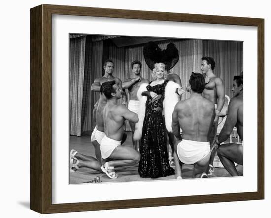 Entertainer Mae West Making Her Nightclub Debut with Loin-Clothed Dancers at Hotel Sahara-Loomis Dean-Framed Photographic Print