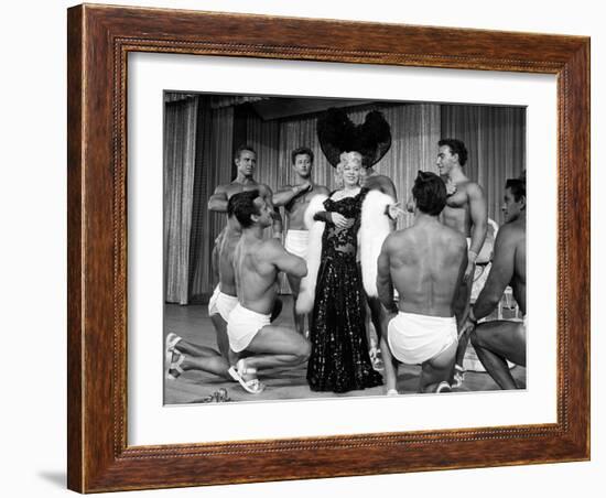 Entertainer Mae West Making Her Nightclub Debut with Loin-Clothed Dancers at Hotel Sahara-Loomis Dean-Framed Photographic Print