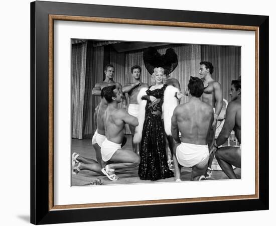 Entertainer Mae West Making Her Nightclub Debut with Loin-Clothed Dancers at Hotel Sahara-Loomis Dean-Framed Photographic Print