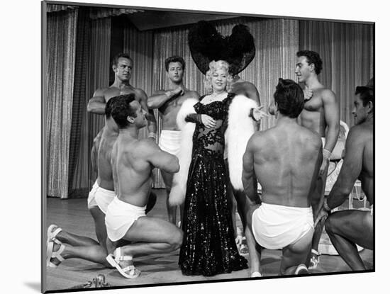 Entertainer Mae West Making Her Nightclub Debut with Loin-Clothed Dancers at Hotel Sahara-Loomis Dean-Mounted Photographic Print