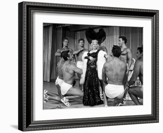 Entertainer Mae West Making Her Nightclub Debut with Loin-Clothed Dancers at Hotel Sahara-Loomis Dean-Framed Photographic Print