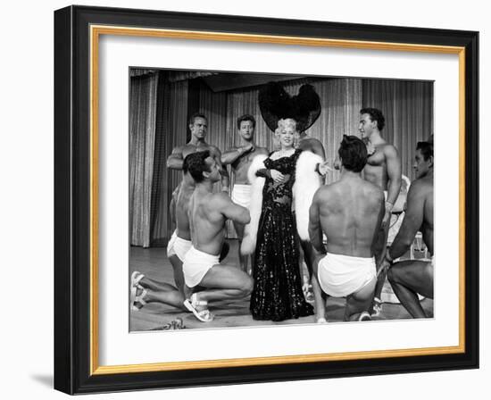 Entertainer Mae West Making Her Nightclub Debut with Loin-Clothed Dancers at Hotel Sahara-Loomis Dean-Framed Photographic Print