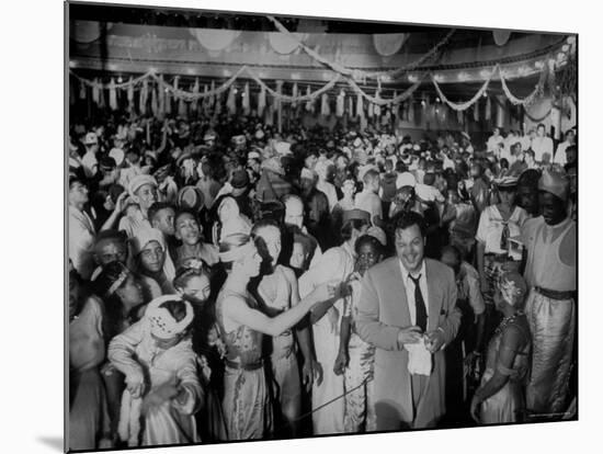Entertainer Orson Welles Attending the Rio de Janerio Carnival Celebration-Hart Preston-Mounted Premium Photographic Print