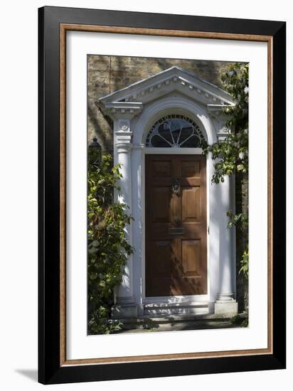 Entrance into a House with Grand Door with Window Lights, Surrounded by Vegetation-Natalie Tepper-Framed Photo