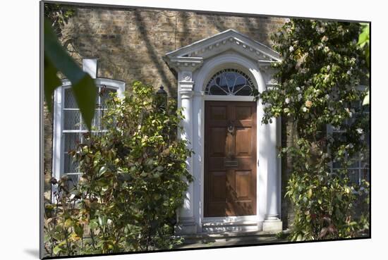 Entrance into a House with Grand Door with Window Lights, Surrounded by Vegetation-Natalie Tepper-Mounted Photo