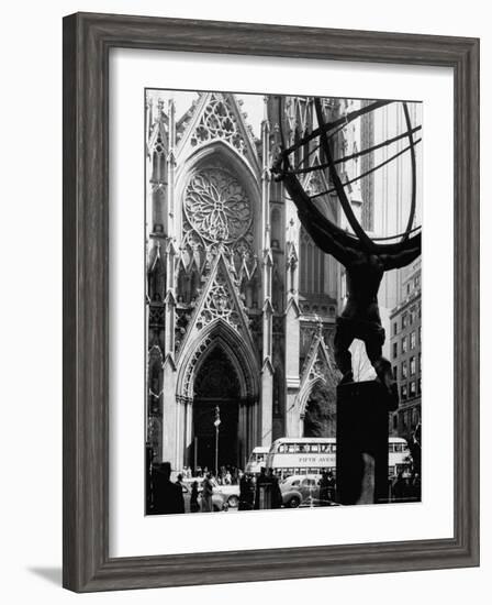 Entrance to St. Patrick's Visible Across Fifth Avenue, with Atlas Statue Silhouetted in Foreground-Andreas Feininger-Framed Photographic Print