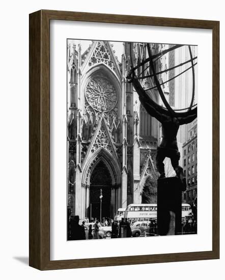 Entrance to St. Patrick's Visible Across Fifth Avenue, with Atlas Statue Silhouetted in Foreground-Andreas Feininger-Framed Photographic Print