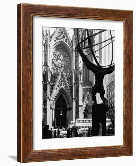 Entrance to St. Patrick's Visible Across Fifth Avenue, with Atlas Statue Silhouetted in Foreground-Andreas Feininger-Framed Photographic Print