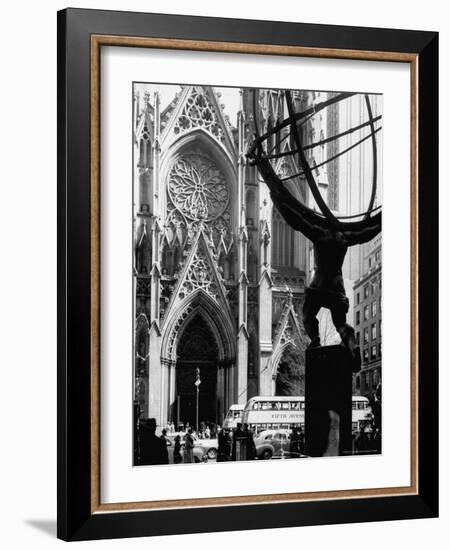 Entrance to St. Patrick's Visible Across Fifth Avenue, with Atlas Statue Silhouetted in Foreground-Andreas Feininger-Framed Photographic Print